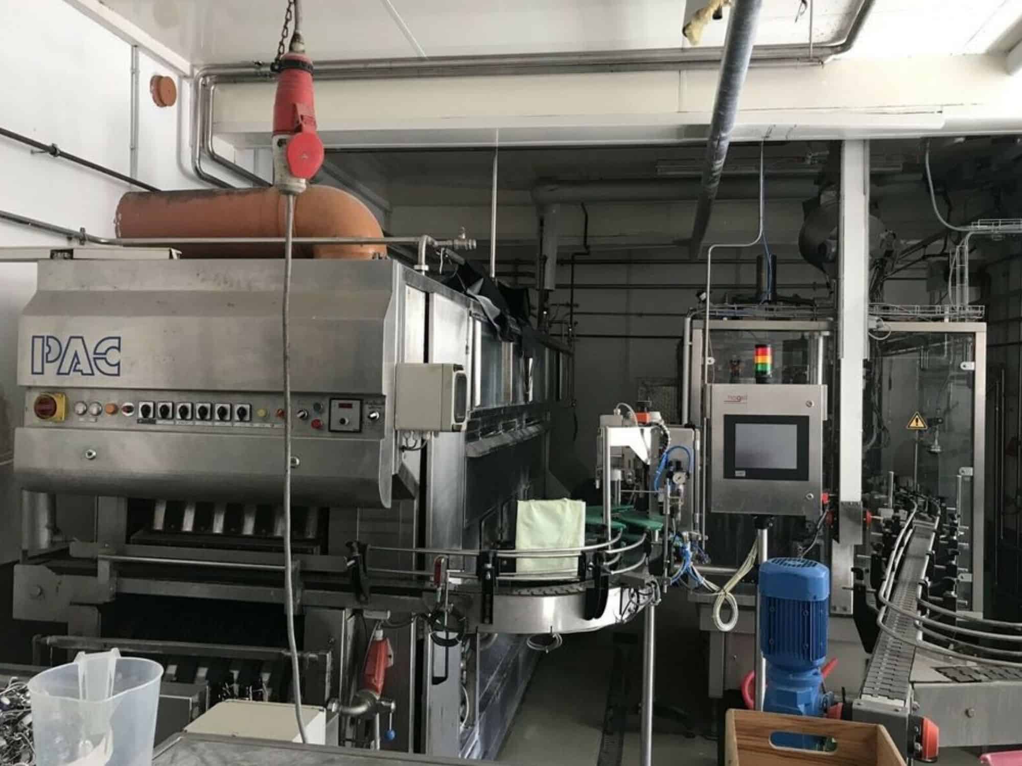 Side view of Nagel, PAC, Juwatec Returnable Glass Filling line for beer, soft drink