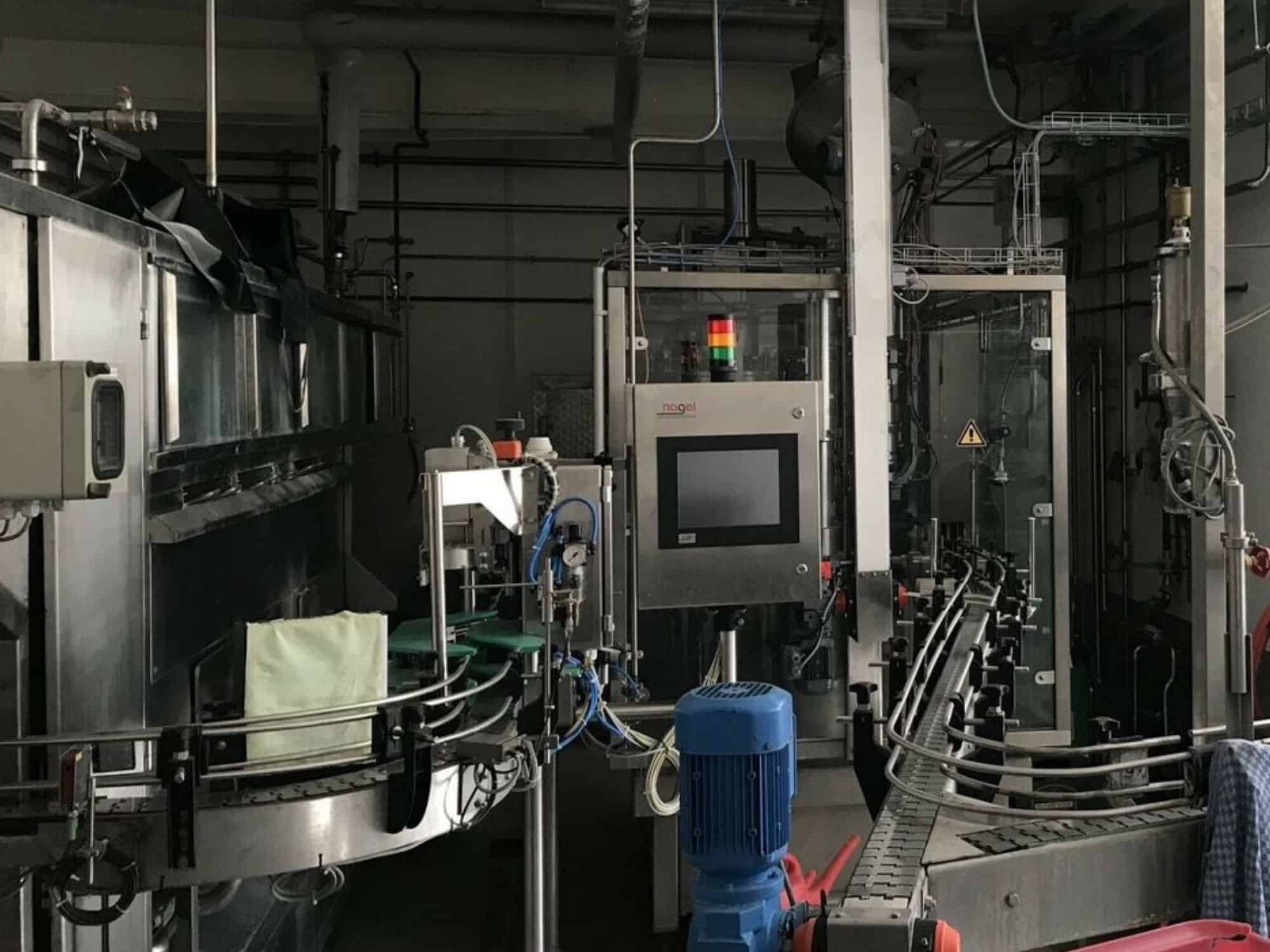 Side view of Nagel, PAC, Juwatec Returnable Glass Filling line for beer, soft drink